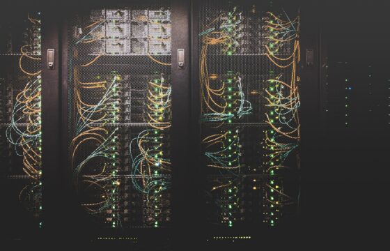Rows of illuminated servers inside a data center